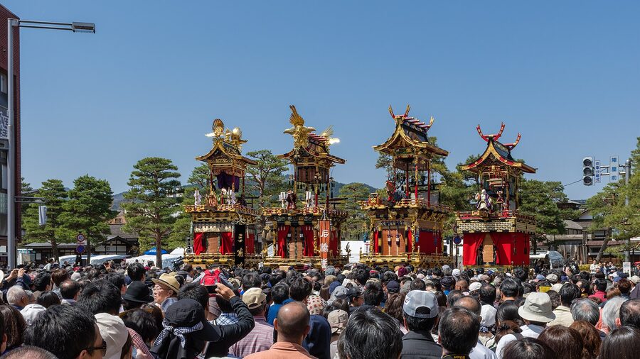 Yatai float at Takayama spring festival with elaborate gold leaf carvings on the upper deck