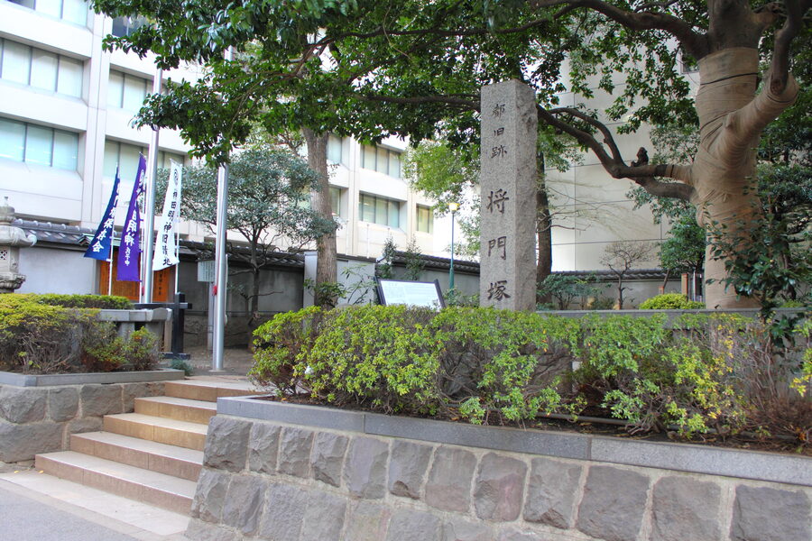 A small fenced shrine in Otemachi Tokyo, surrounded by office towers, marking the burial mound of Taira no Masakado's severed head.