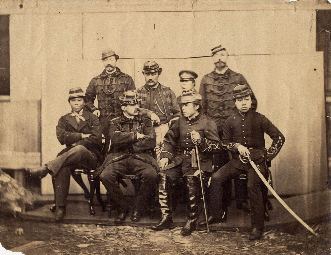 Group portrait of French military advisor Jules Brunet seated with Japanese pro-shogunate officers in Hokkaido during the Boshin War