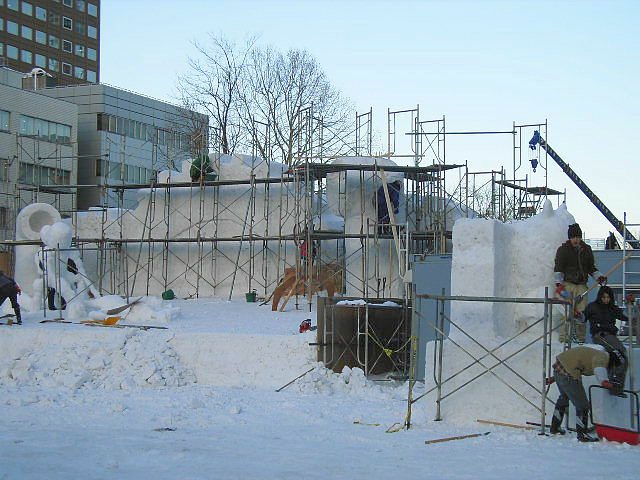 Scaffolding wraps a half-finished snow statue at Yuki Matsuri 2005