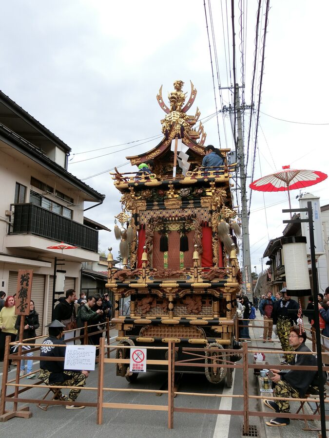 Kirin-tai spring yatai with mythical qilin sculpture being moved through Takayama