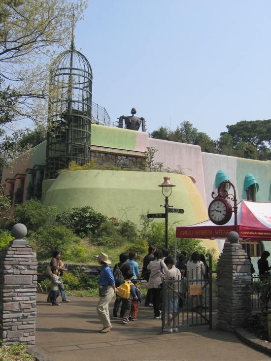 Painted exterior of the Studio Ghibli Museum in Mitaka Tokyo with curved storybook windows