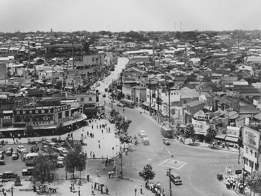 Shibuya Tokyo 1952 with Hachiko statue surrounded by benches looking west