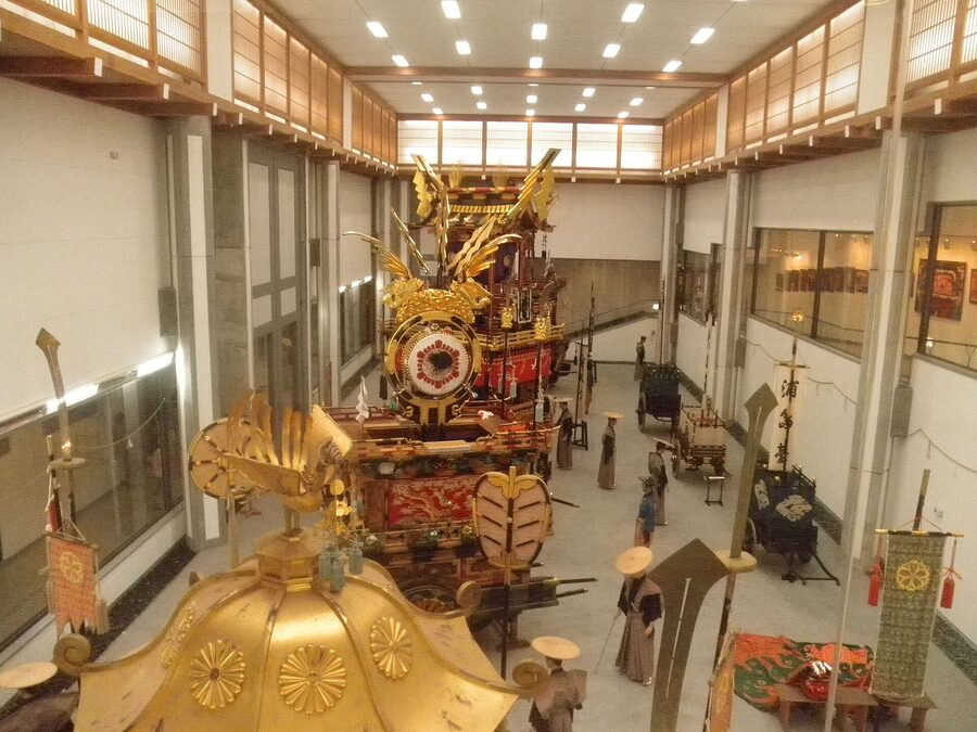 Hachiman festival yatai displayed at Yatai Kaikan with painted panels