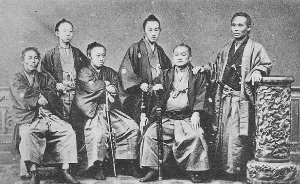 1869 photograph of young Ito Hirobumi seated next to Okubo Toshimichi in a Tokyo studio shortly after the Meiji Restoration