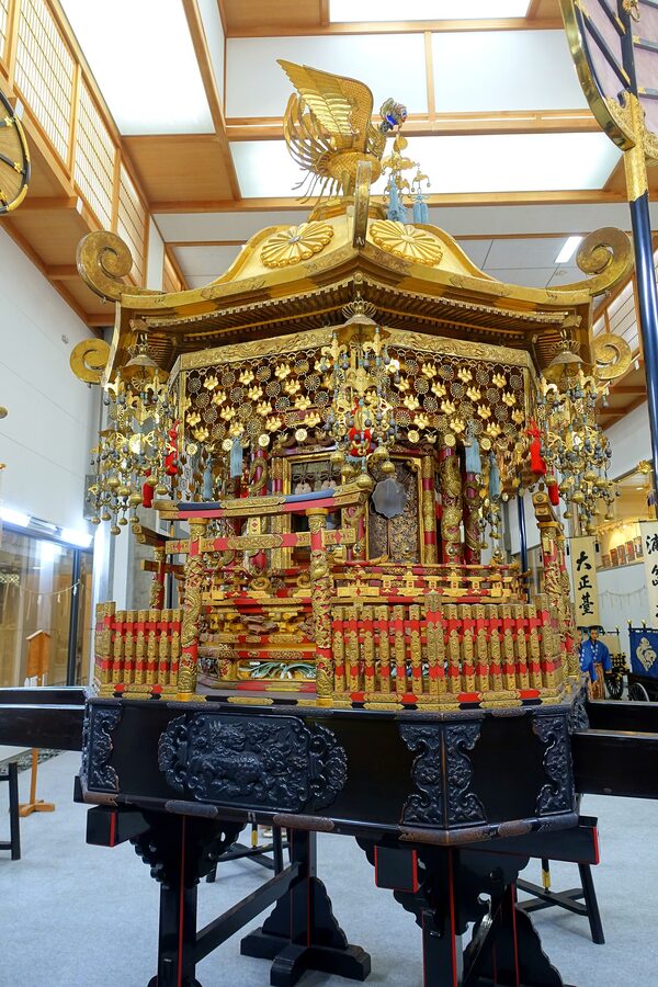 Hachiman shrine mikoshi black-lacquer portable shrine on display at Yatai Kaikan