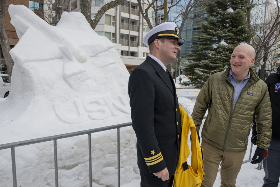 Officers in conversation at the 75th Sapporo Snow Festival 2025