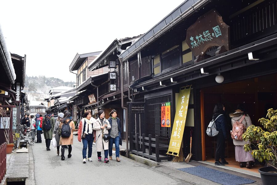 Sannomachi street in Takayama with sake brewery cedar ball and lattice frontages