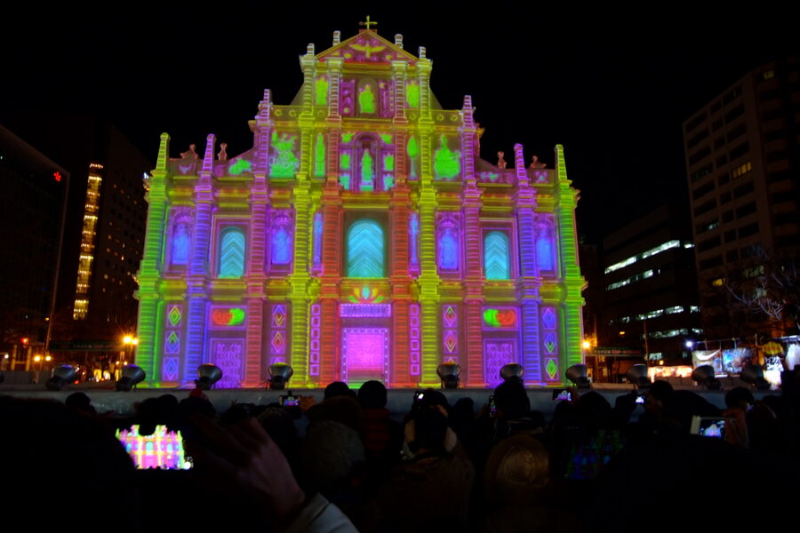 Visitors photograph a giant historical snow sculpture at the 67th Sapporo Snow Festival