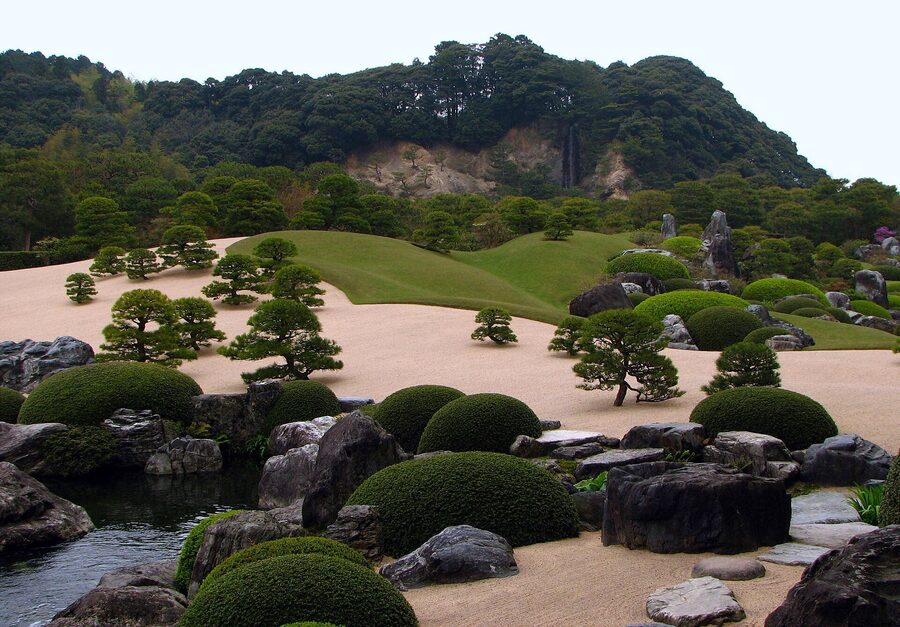 The eastern hills of Yasugi serve as borrowed scenery behind the Adachi garden