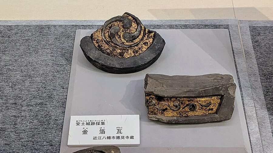 Gold-leafed roof tile fragment recovered from the Azuchi Castle archaeological dig, now in the collection of Soken-ji temple and exhibited at the Shiga Prefectural Azuchi Castle Archaeological Museum
