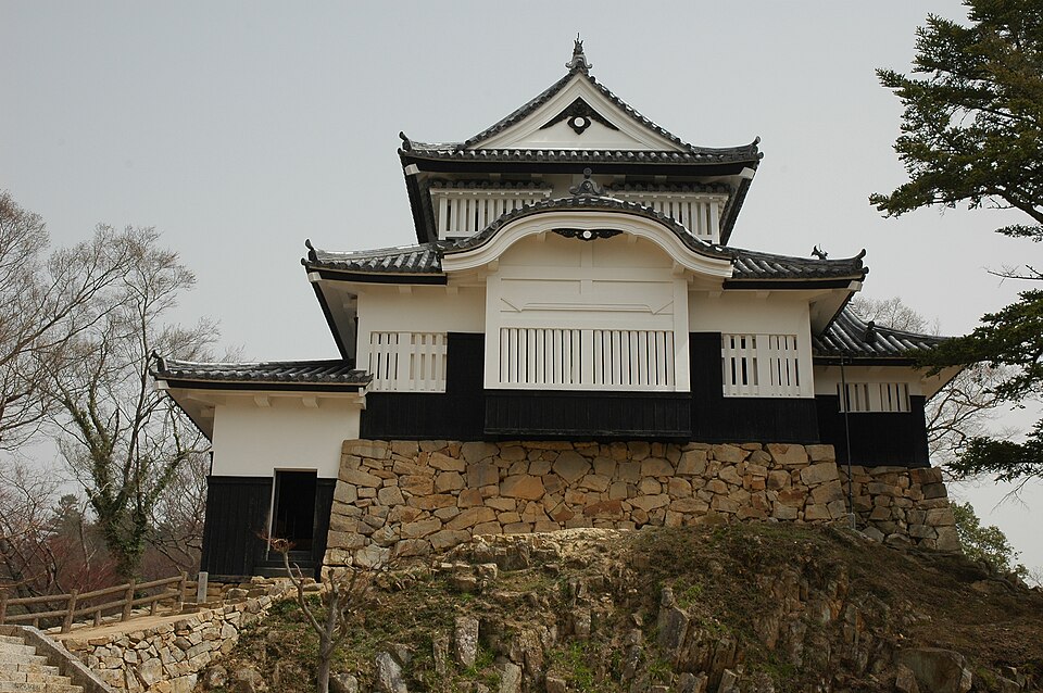 Bitchu Matsuyama Castle tenshu interior showing the 1683 Mizunoya era wooden ceiling beams and vertical tate-renji lattice windows inside the main keep