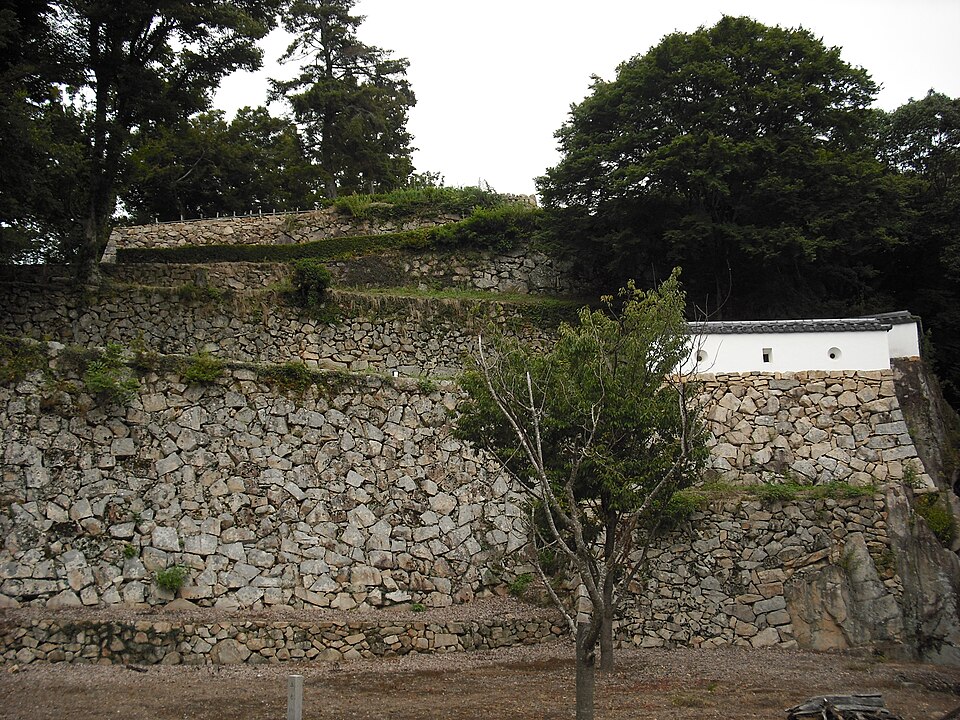 Bitchu Matsuyama Castle tenshu south face with the curved karahafu bay window and the stepped dashi-mado oriel windows visible on the upper storey