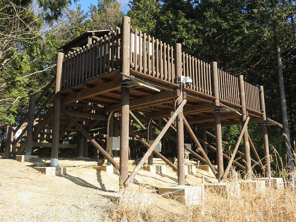 Bitchu Matsuyama Castle in winter surrounded by a dense unkai sea of clouds at dawn in January viewed from the Fukiyama observation point