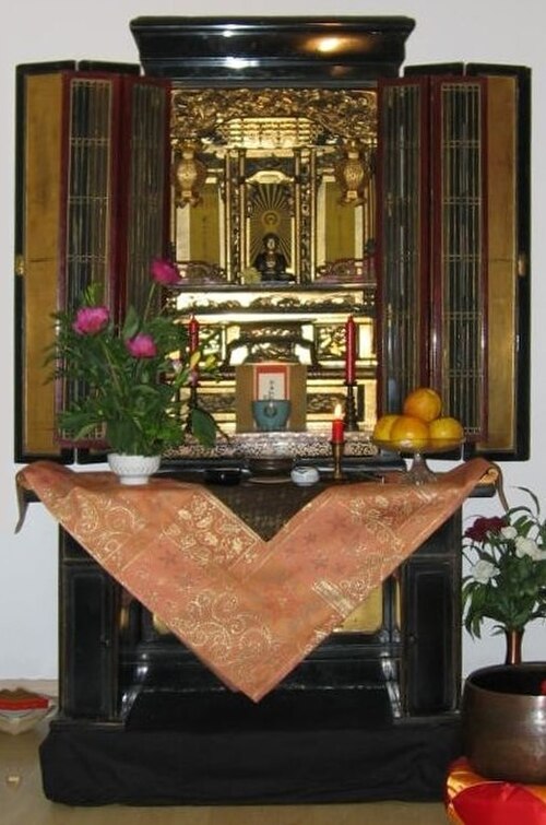 A traditional Japanese butsudan altar with gold-leaf interior at ShinDo Buddhist Temple