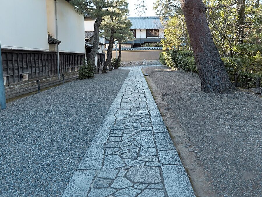 Raked white-sand river flowing between rock arrangements at Daisen-in karesansui