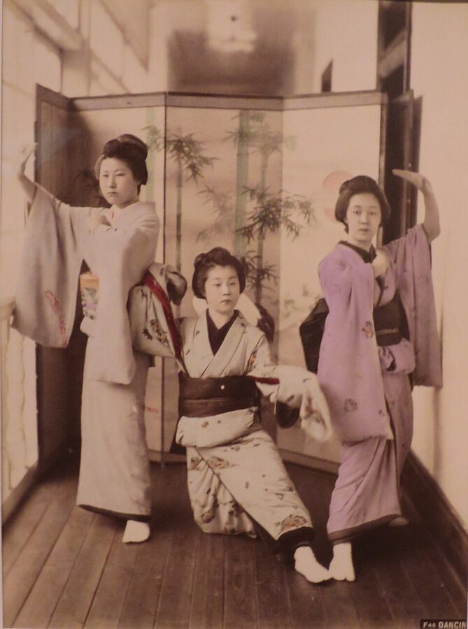 Meiji era Japanese women in traditional kimono photographed dancing by Italian photographer Adolfo Farsari in late 1880s Yokohama