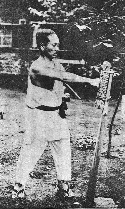 Funakoshi Gichin striking the makiwara training post in 1924