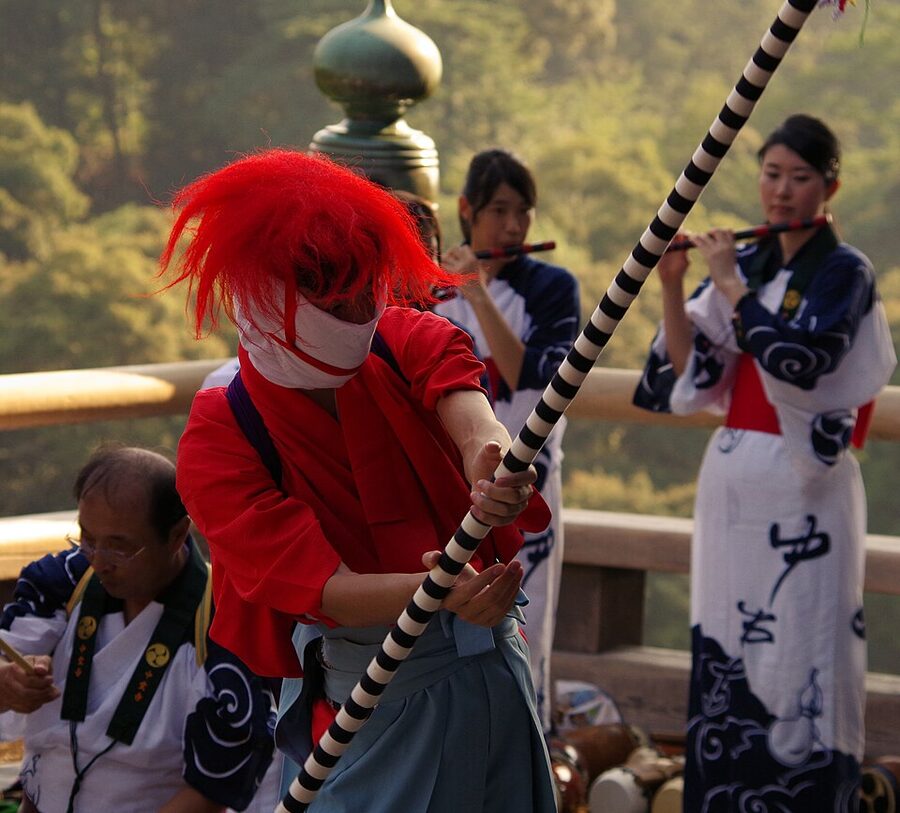 Gion-bayashi festival music performers practicing bo-furi stick-swing dance for Gion Matsuri