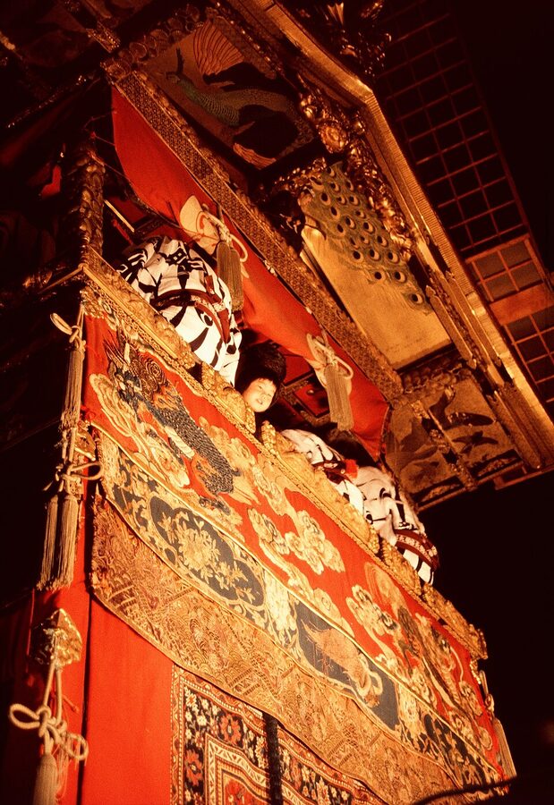 Evening illuminated yamaboko float against Kyoto night sky during Gion Matsuri
