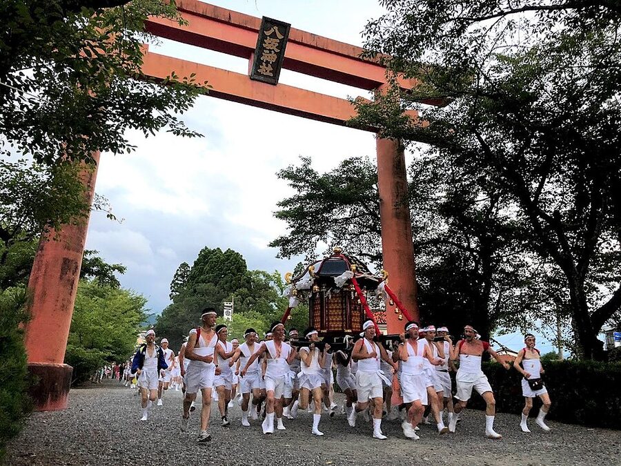 Mikoshi portable shrine leaving the South Tower Gate of Yasaka shrine during Gion Matsuri mikoshi-togyo