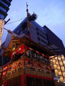 Naginata-hoko yamaboko float decorated with lanterns during Yoiyama evening of Gion Matsuri in Kyoto