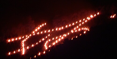 The Myo kanji character burning during Kyoto Gozan no Okuribi sending-off fire ceremony