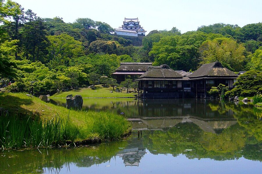 Hikone Castle tenshu panoramic view with surrounding walls and old Otsu Castle recycled materials visible in the keep