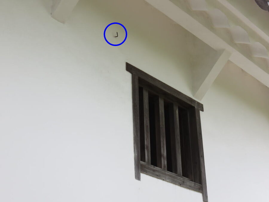 Himeji Castle covered in black camouflage netting during World War II to hide the white plaster from US bomber crews