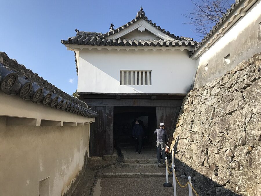 Ni-no-mon gate at Himeji Castle showing defensive stone-drop chutes built into the ceiling