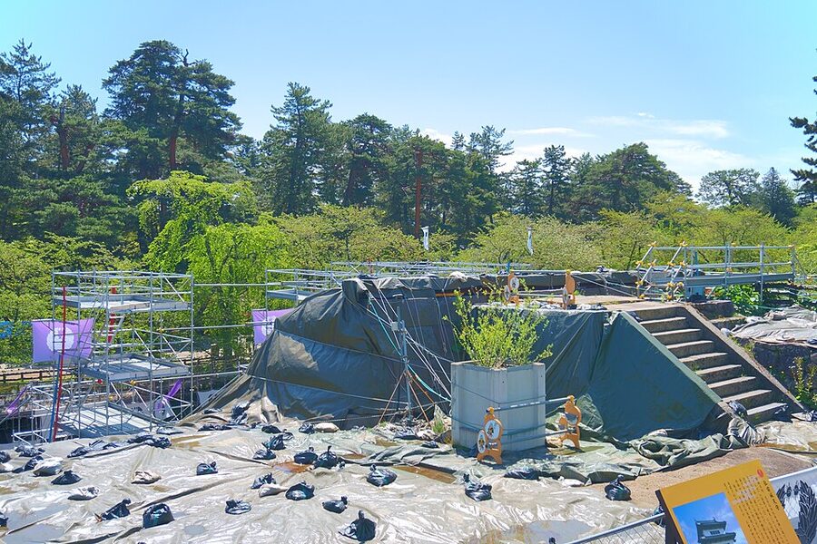 Excavated stone wall base where Hirosaki Castle tenshu previously sat before the 2015 relocation with the wall removed for repair