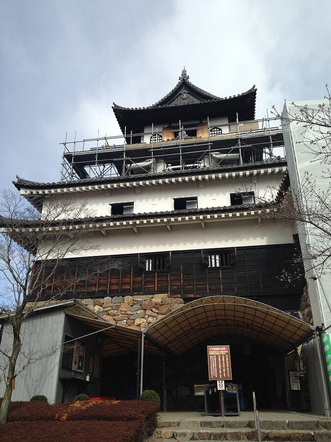 Inuyama Castle tenshu close up from the south showing the four storey irregular design and karahafu ornamental gables