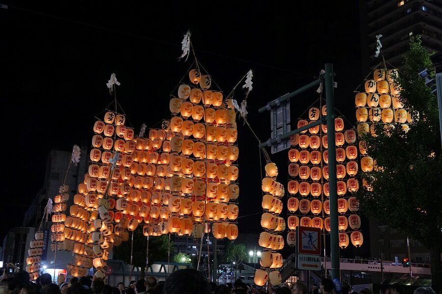 Multiple kanto poles aligned during the night parade Akita 2023