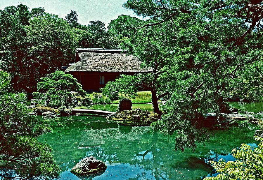 Stone stepping stones path and stone lantern through pine grove at Katsura Imperial Villa
