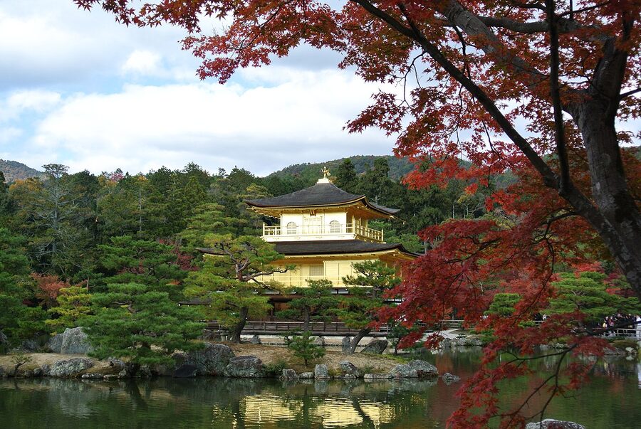 Kinkaku-ji the Golden Pavilion framed by red autumn maple leaves in late November 2013 in Kita ward Kyoto