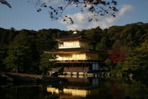 Kinkaku-ji the Golden Pavilion in Kita ward Kyoto built by Ashikaga Yoshimitsu in 1397 reflected in Kyoko-chi mirror pond on a clear day