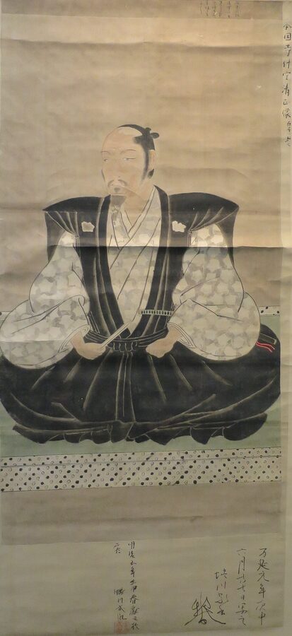 Ninagawa Chikatane painted portrait of Kato Kiyomasa holding an ornate fan, in formal seated posture with white hakama trousers