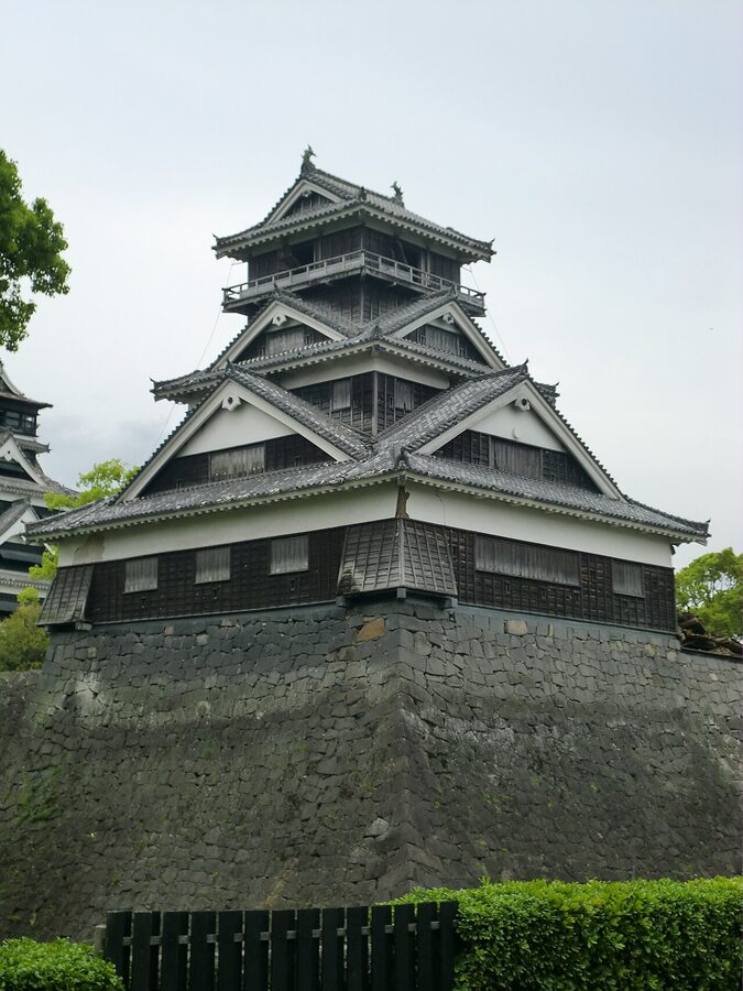Uto Yagura at Kumamoto Castle after April 2016 earthquake with visible damage to upper floors and surrounding stone walls collapsed