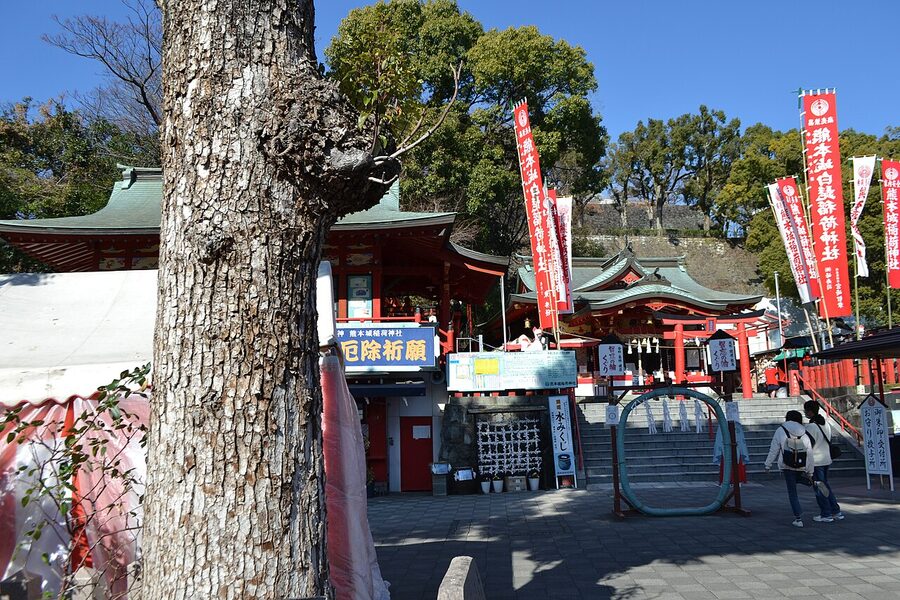 Kumamoto Castle Inari shrine small vermillion shrine in the castle grounds with torii and stone path