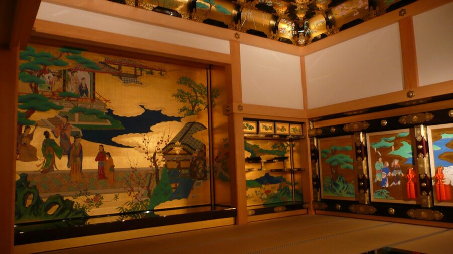 Shokun-no-ma interior at Kumamoto Honmaru Goten with reconstructed gold-leaf panels showing Wang Zhaojun narrative