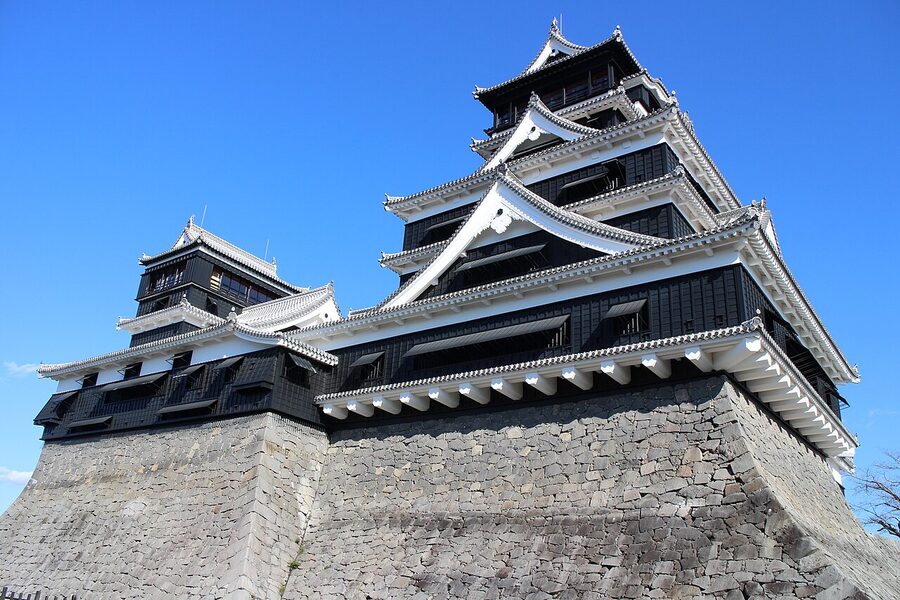 Kumamoto Castle main keep and small keep stand side by side above the honmaru stone plinth after the 2019 exterior restoration