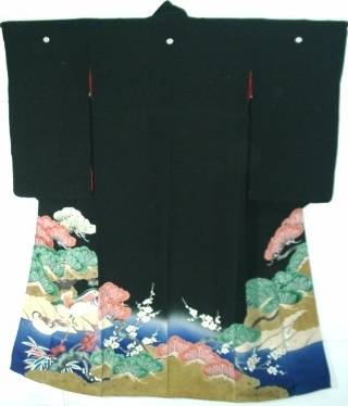 Black kurotomesode kimono with five family crests and embroidered hem worn by married Japanese woman at formal ceremony