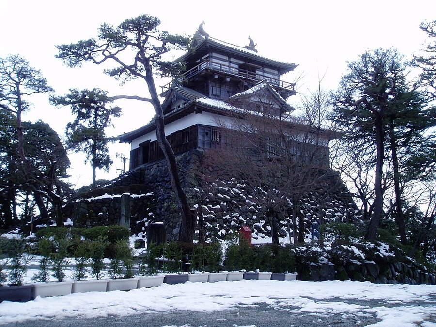 Maruoka Castle keep lower approach photograph showing the rebuilt stone base and the keep tower above it