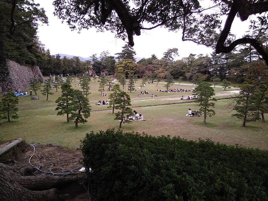 Steep internal wooden staircase inside Matsue Castle