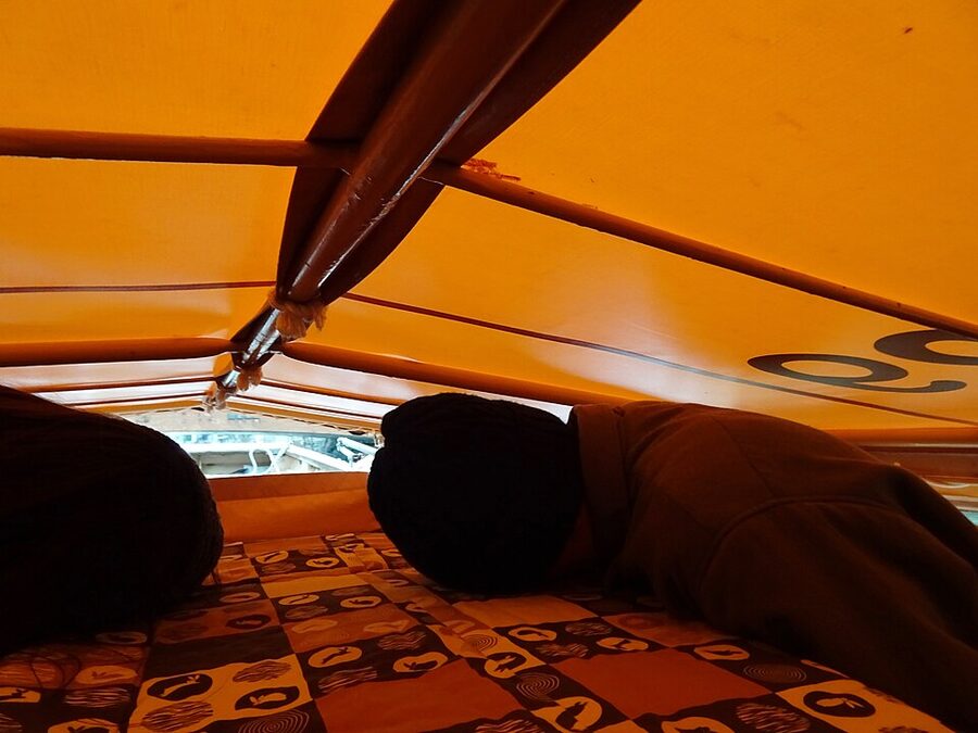 Horikawa boat with its canvas roof lowered to pass under a low bridge