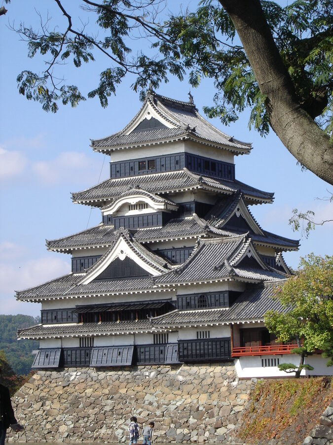 Matsumoto Castle tenshu photographed from the Honmaru garden in 2006 showing the five-tower complex that served as the administrative headquarters of Matsumoto Domain through the Edo period