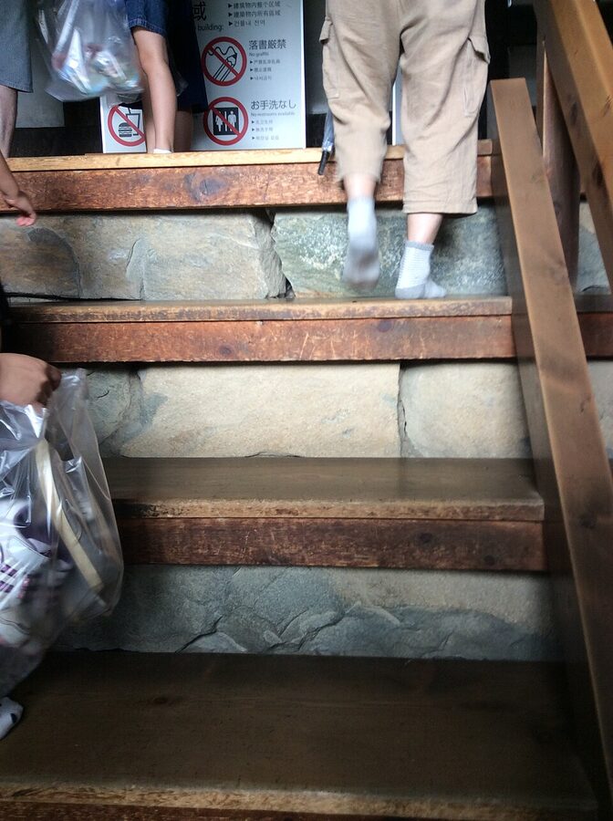 One of the original 16th-century steep wooden interior staircases inside Matsumoto Castle tenshu with a gradient approaching 61 degrees between floors