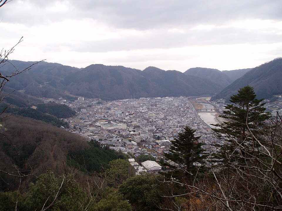 Mount Gagyu viewed from Takahashi city below showing the long four-peaked ridge that rises to 487 meters with the castle honmaru at 430 meters on the Komatsu peak