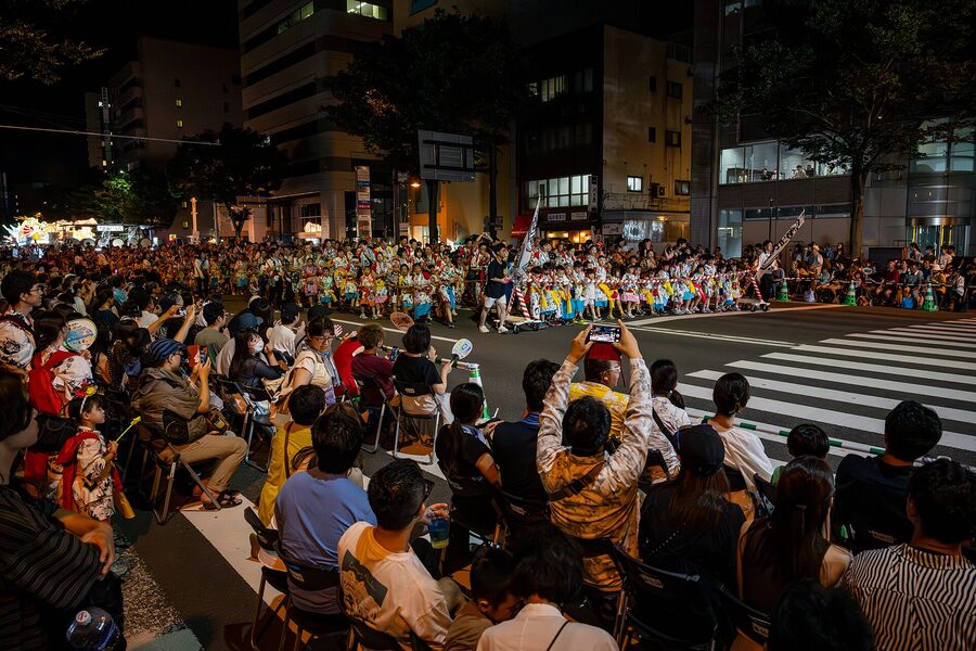 US Air Force personnel from Misawa join an Aomori Nebuta haneto group as costumed jumpers, 2025.