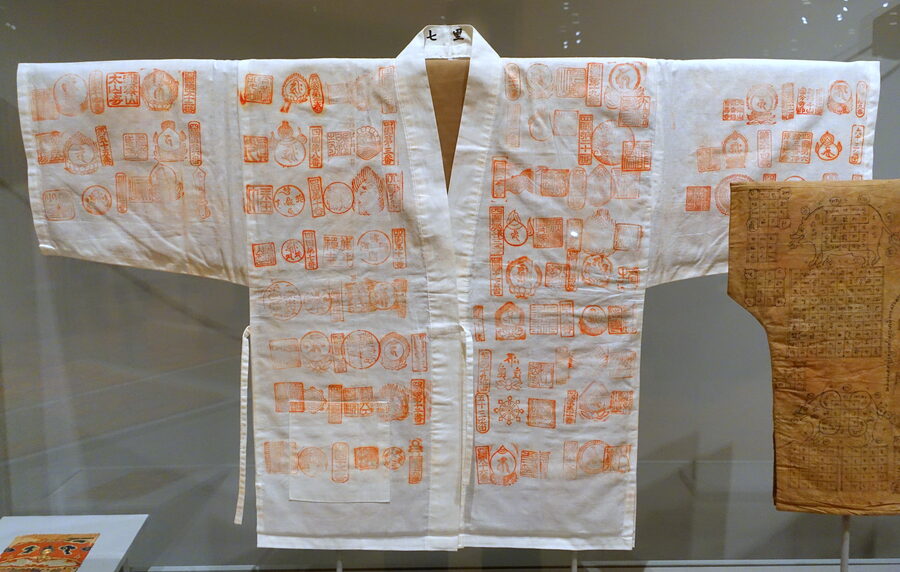 Edo-period stamped pilgrim jacket for the Kumano route, with circular shrine stamps in red
